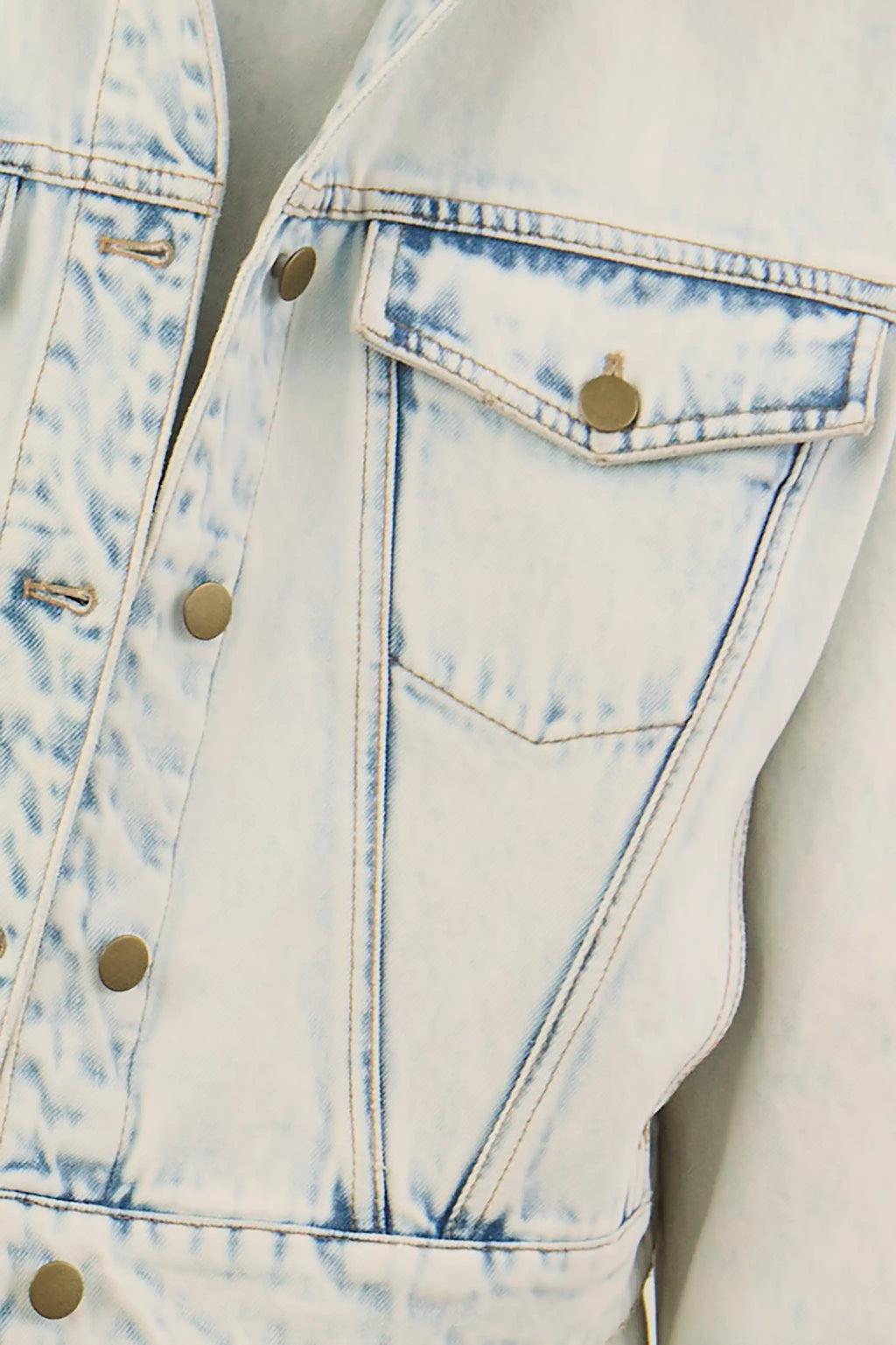 Close up of the Solene Jacket in Washed Blue Denim. 