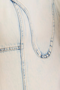 Close up of The Sedona Dress in Washed Blue Denim. 