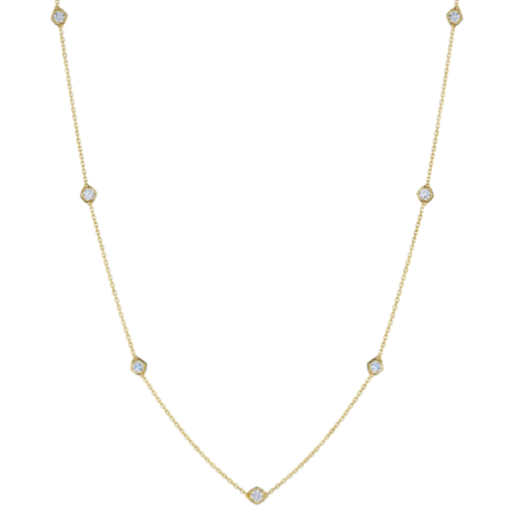 The Small Serpentine Station Necklace features hexagon bezel set diamonds in a delicate white gold design, shown on a plain white background.