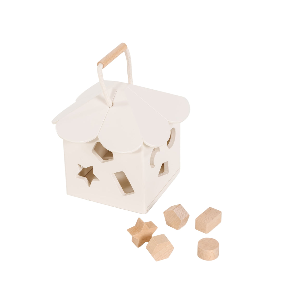 Three-quarter view of ivory wooden shape sorter showcasing scalloped roof with rope handle and six wood shapes on white