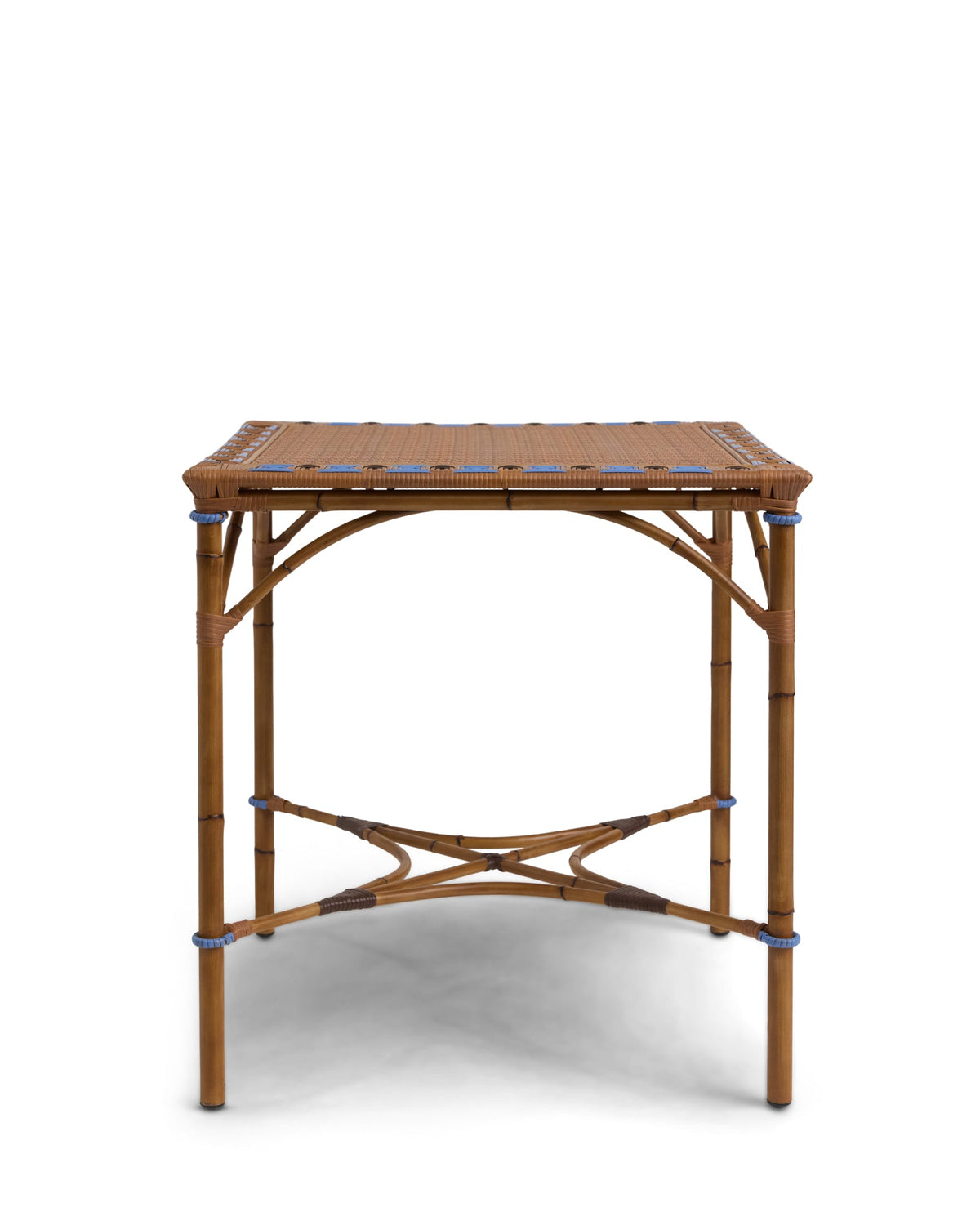 Front view of Juliette dining table showing handwoven hickory brown synthetic rattan top and bamboo look frame with blue trim on white background