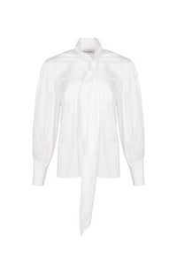The Shay Blouse is designed with a tie-front neckline and long sleeves with angled button cuffs