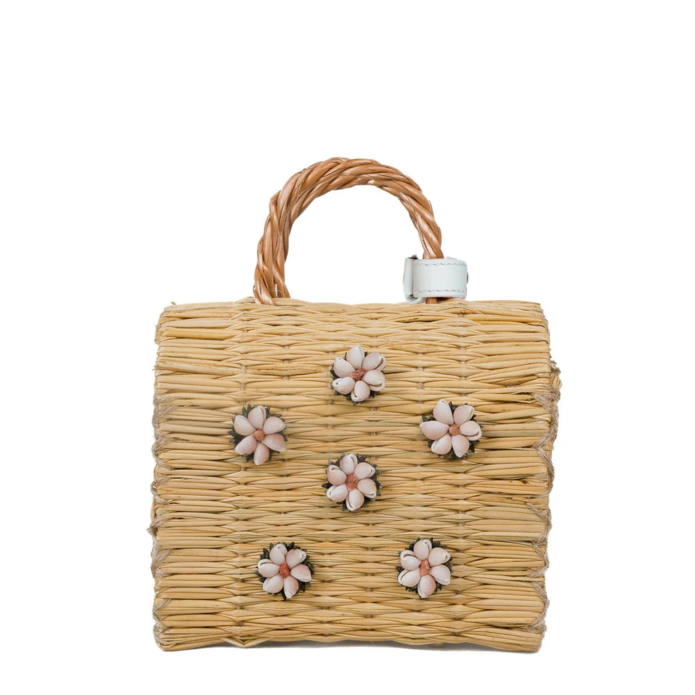 Front view of Shella Mini white woven reed bag showcasing shell flower embellishments and braided top handle on white background