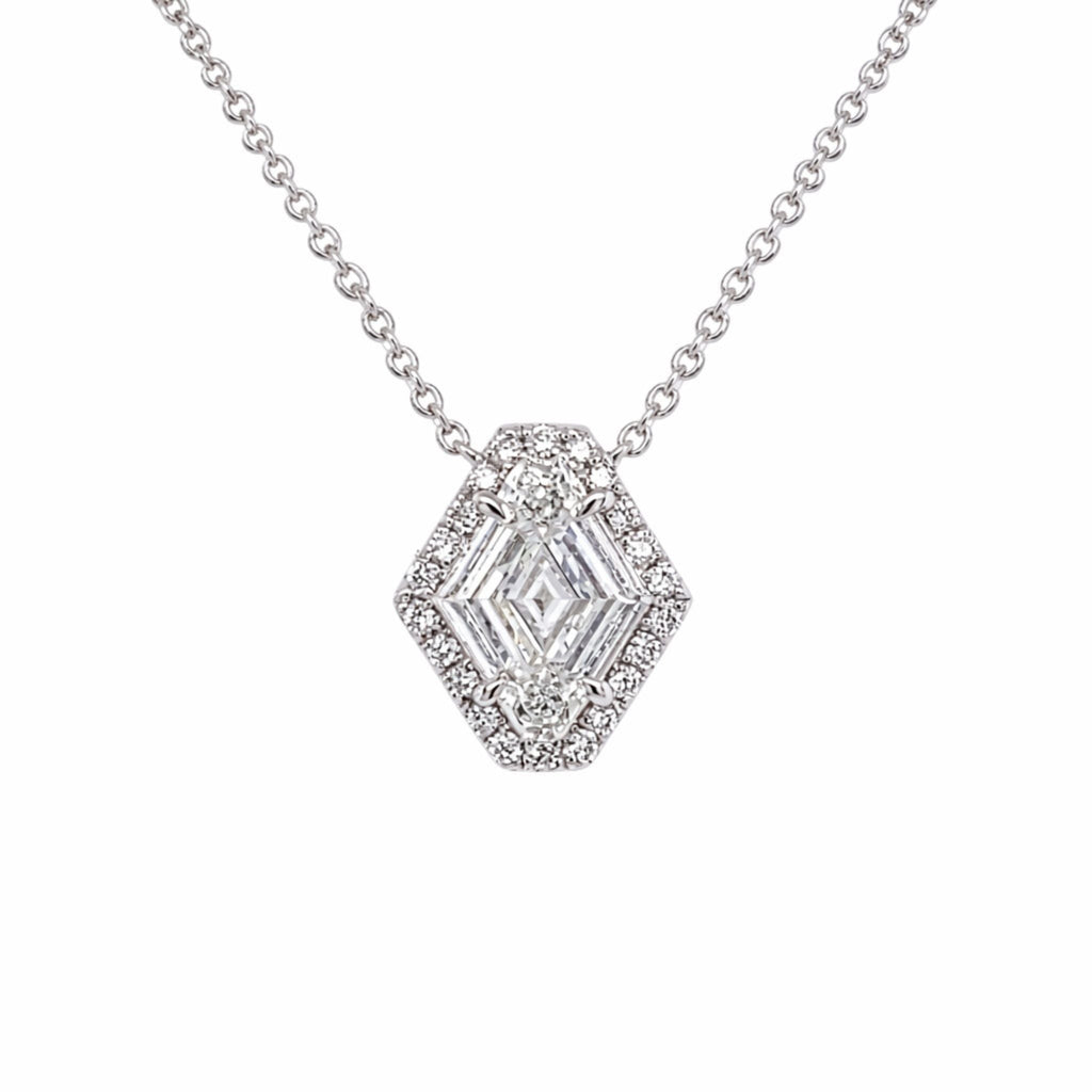 The North-South Shield Diamond Necklace with Pavé Halo in white gold features an 18-inch silver chain and a hexagon-shaped pendant adorned with clear gemstones and a pavé halo of sparkling round stones.