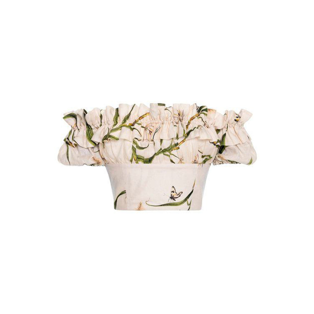 Front view of Pimienta Azucar cropped linen off-the-shoulder top showcasing ruffled neckline and botanical embroidery on white background