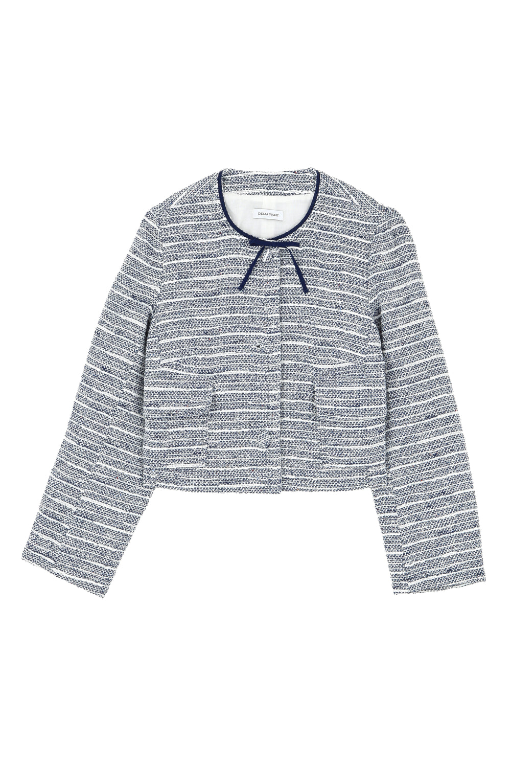 Flat lay of Lee jacket in Bon Voyage tweed showing navy-trimmed round neck with grosgrain bow and tweed-covered buttons