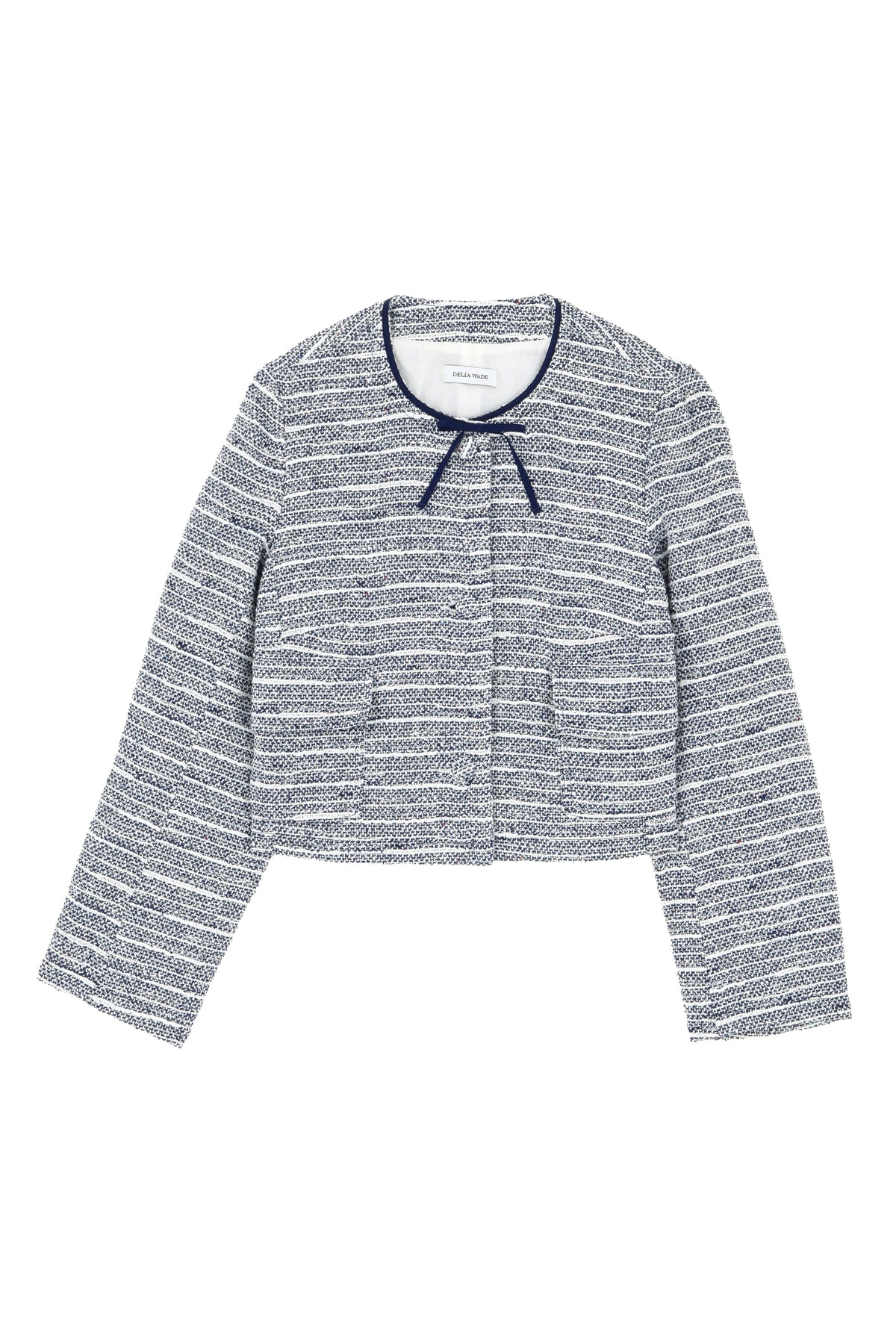 Flat lay of Lee jacket in Bon Voyage tweed showing navy-trimmed round neck with grosgrain bow and tweed-covered buttons