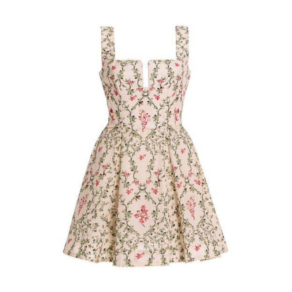 Front view of Agua Cauca mini dress showing structured sweetheart bodice with wide straps, cinched waist, and full floral-print mini skirt on white background