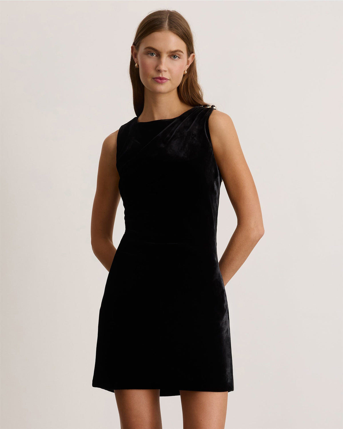 Front view of Short Sasha Dress in Black showcasing a sleeveless short silhouette on a model against a light background
