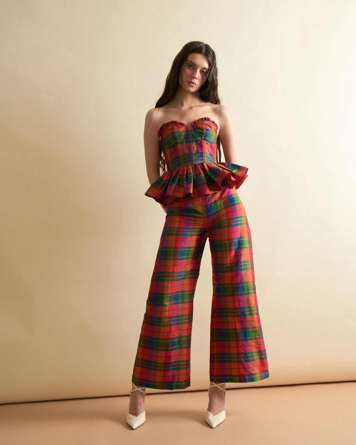 Front view of Libby Pant in Island Holiday showcasing colorful plaid wide cropped leg on model against beige backdrop