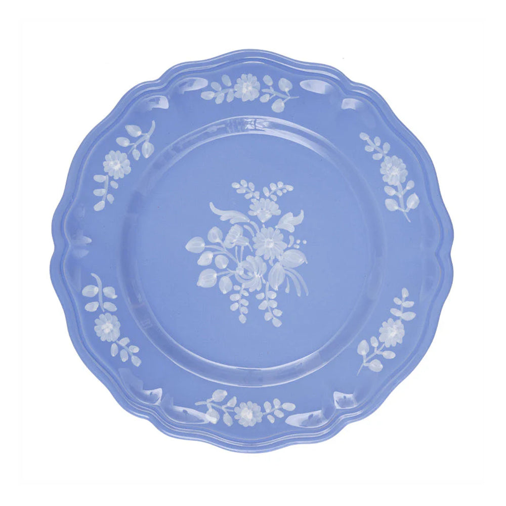Top view of Sicilia Periwinkle dinner plate showing white hand painted floral motif on periwinkle blue scalloped ceramic