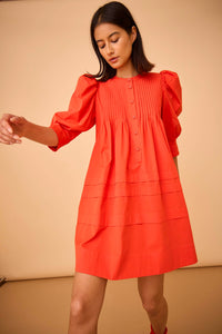 The Sidney dress has a crew neckline, ¾ length sleeves, pintuck detailing, side seam pockets.