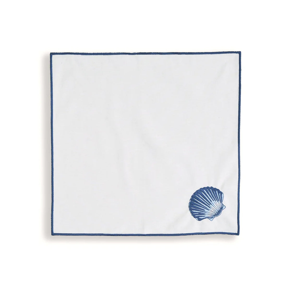 Top view of Siena Coquillage Napkins, Set Of 4 showcasing a single clam shell and navy trim on white fabric