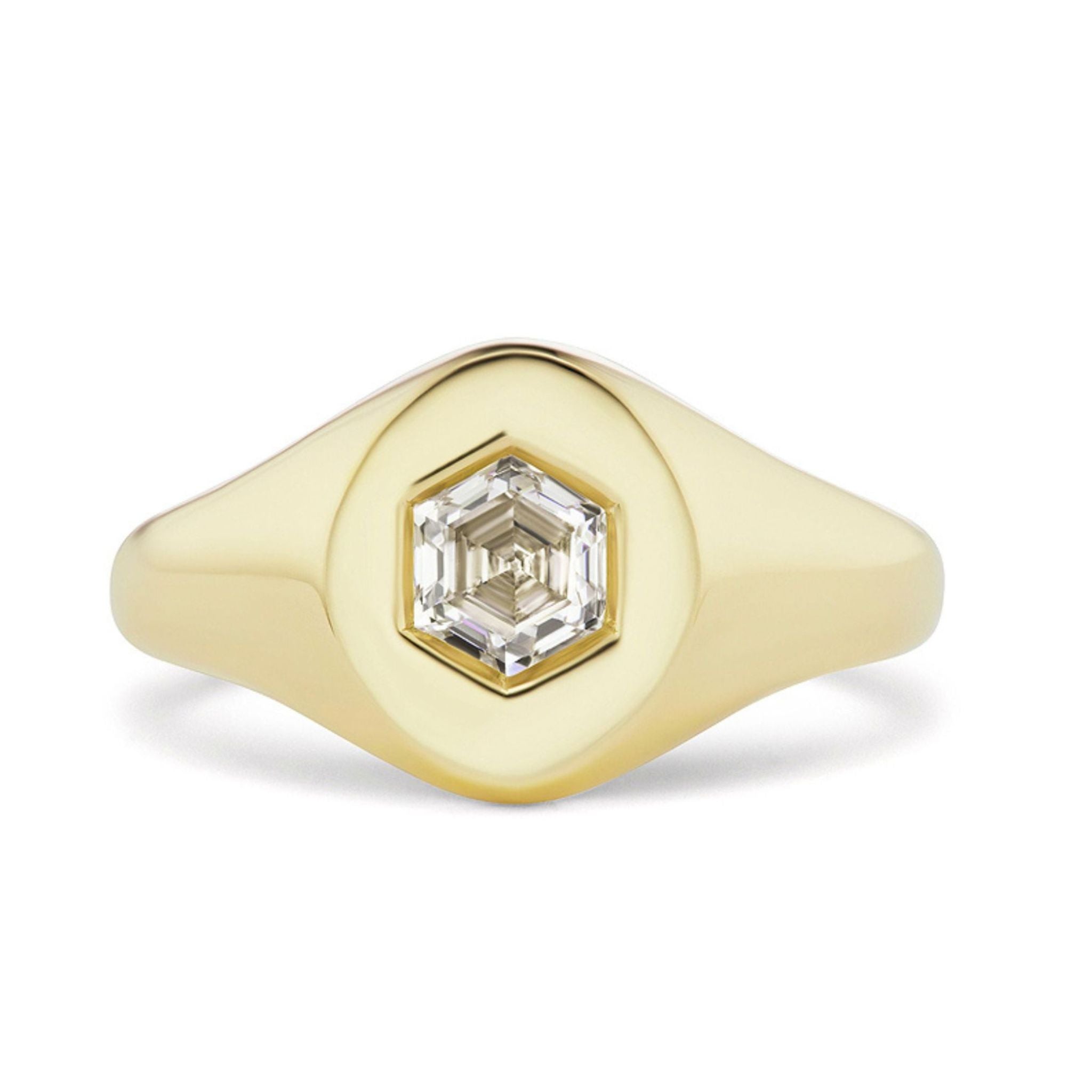 The Signet Ring with Burnish Set Hexagon Diamond features a smooth, rounded 18k gold band and a flat polished top adorned with a hexagon-shaped diamond set at the center.