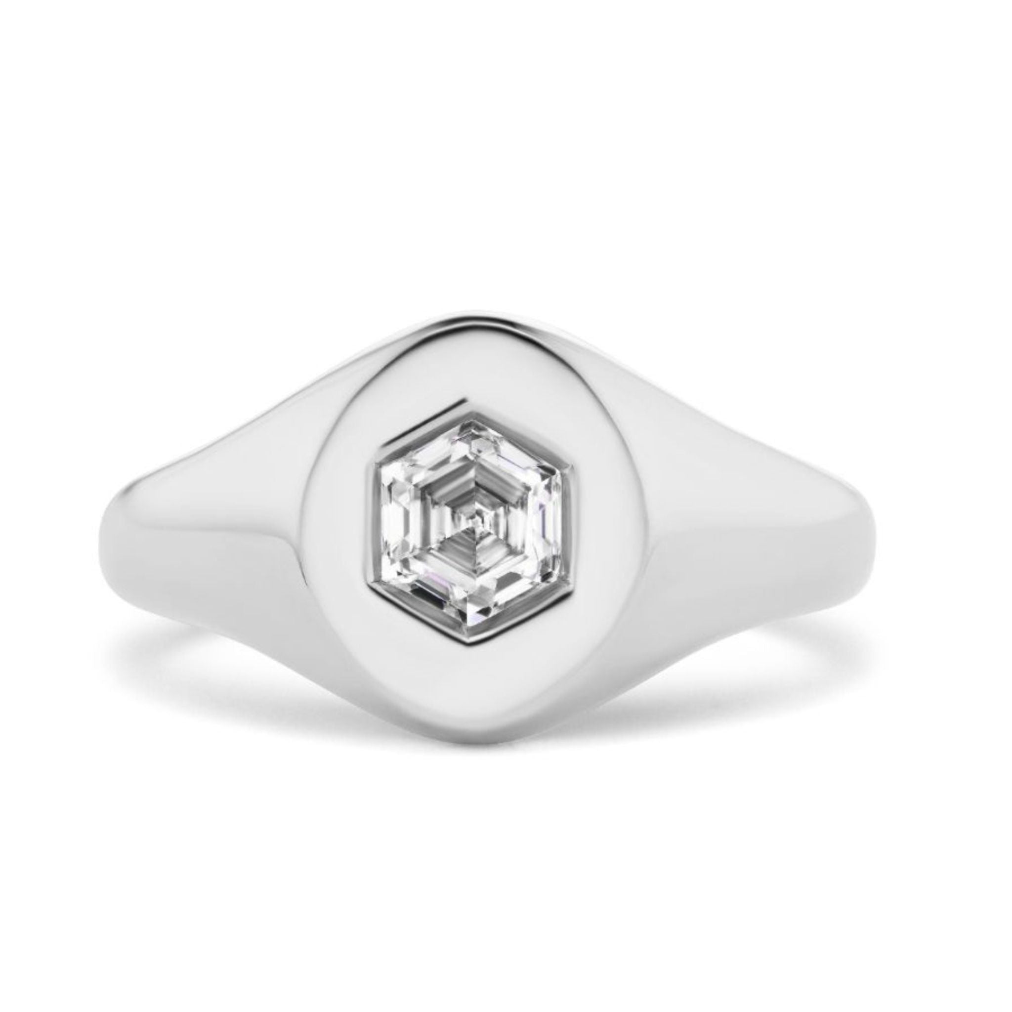 The Signet Ring with Burnish Set Hexagon Diamond showcases a sleek silver design with a faceted hexagon diamond at the center, displayed against a white background.