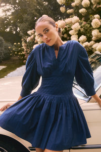 Navy diamond-smocked novelty shirting fabric with a soft V effect and blouson sleeves.