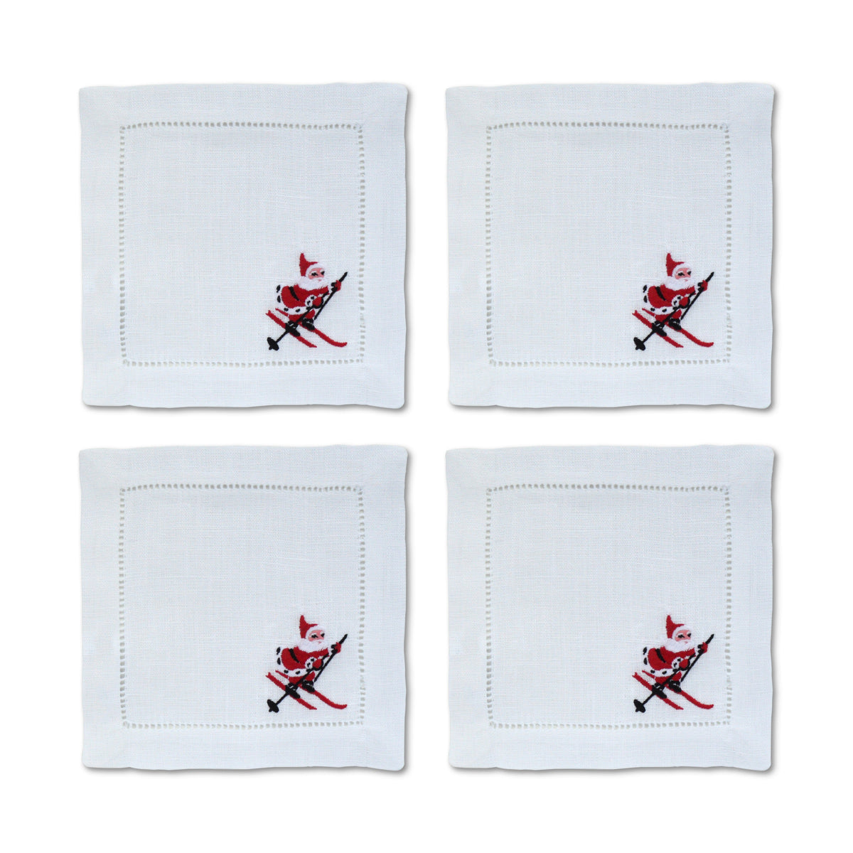 Front view of Skiing Santa Cocktail Napkins, Set of 4 showcasing white linen fabric, scalloped edging, and skiing Santa motif