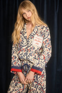 Pajama set with a long sleeve collared button front shirt and an elastic waist pull on pant.