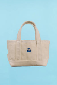 The back of the small canvas tote bag with Hunter Bell logo