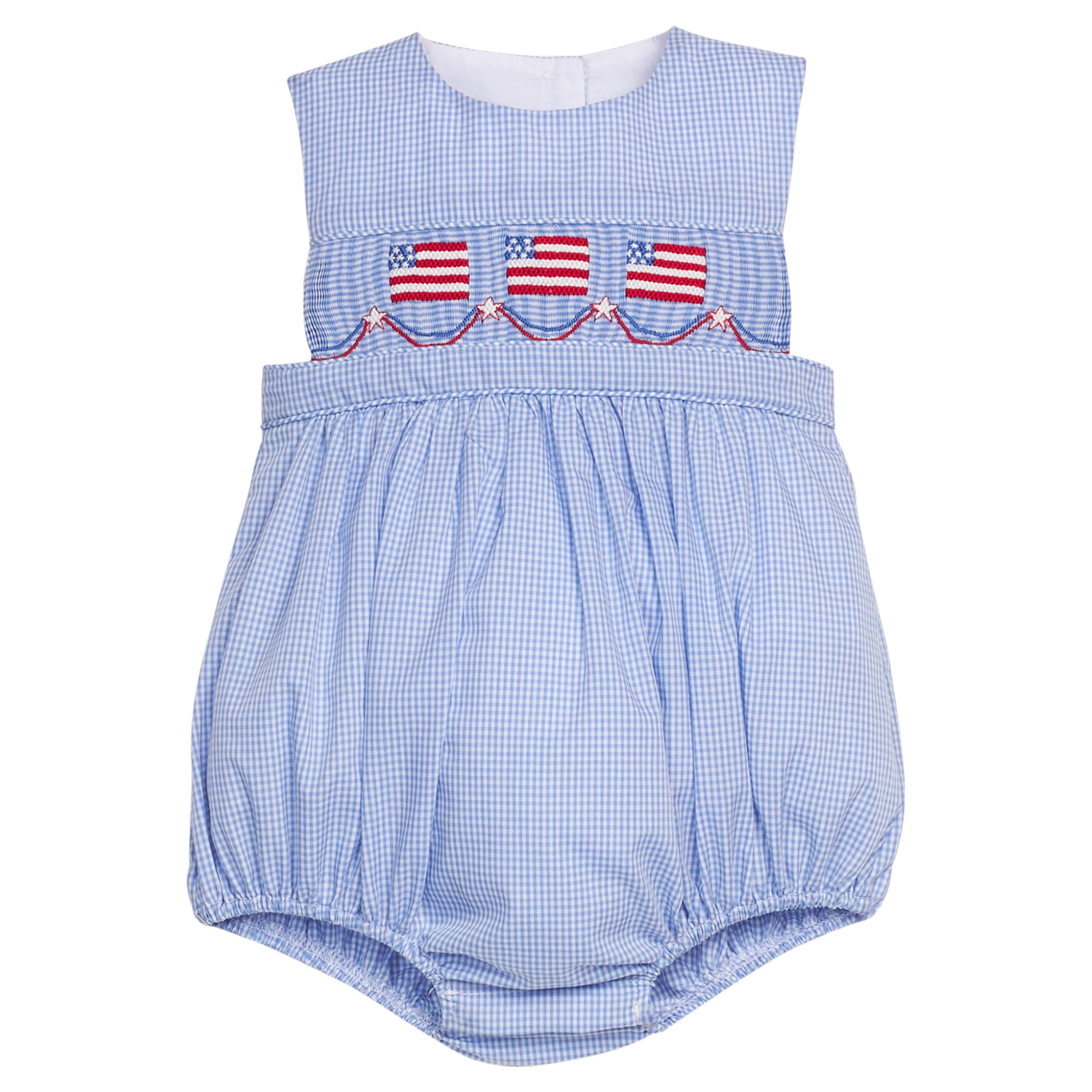 Little English traditional children's clothing.  Sleeveless bubble in royal blue mini check fabric and smocking at the chest with American flag bunting for baby boys