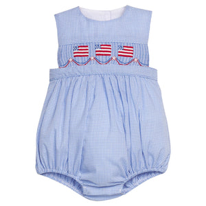 Little English traditional children's clothing.  Sleeveless bubble in royal blue mini check fabric and smocking at the chest with American flag bunting for baby boys