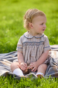 Little English classic children's clothing.  Smocked peter pan bubble in tan and blue Durham windowpane with blue piping for baby boys