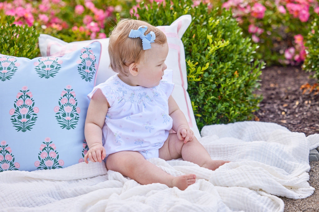 Little English traditional children's clothing.  Smocked pima cotton knit bubble with bow and flower print for baby girls for Spring