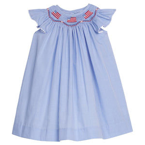 Little English traditional children's clothing. Flutter sleeve dress for toddler girls in royal blue mini gingham with smocking at the collar and American flag bunting