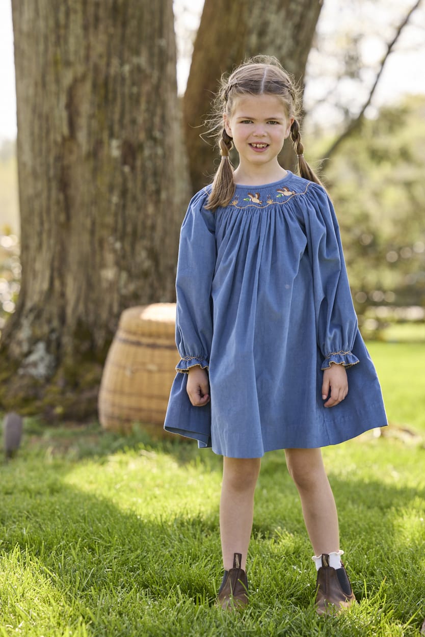 Little English traditional children's clothing.  Long sleeve stormy blue corduroy dress with flying mallard collar around the neckline for little girls.