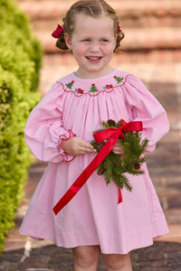 Little English traditional children's clothing.  Long sleeve pink corduroy dress with Christmas motif smocking around the neckline for little girls.