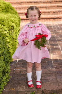 Little English traditional children's clothing.  Long sleeve pink corduroy dress with Christmas motif smocking around the neckline for little girls.