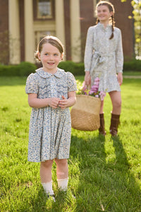 Little English traditional children's clothing. Capped sleeve blue, brown, and cream floral smocked dress with peter pan collar for little girls.