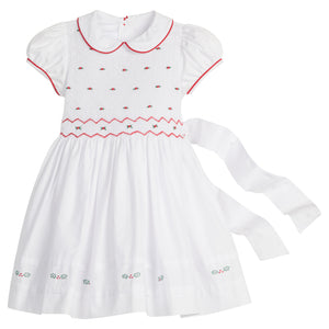 little english classic children's clothing white peter pan collar dress with cap sleeves and smocked detailing with red piping and holly embroidery for girls holiday 