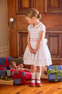 little english classic children's clothing white peter pan collar dress with cap sleeves and smocked detailing with red piping and holly embroidery for girls holiday 