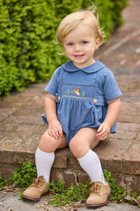 Little English classic children's clothing.  Baby boys stormy blue corduroy peter pan bubble with button tabs and flying mallard smocking across the chest.