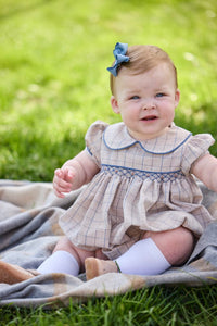 Little English classic children's clothing.  Smocked peter pan bubble in tan and blue Durham windowpane with puff sleeves and blue piping for baby girls
