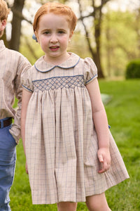 Little English traditional children's clothing.  Smocked peter pan dress in tan and blue Durham Windowpane with capped sleeves for toddler girls