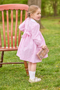 little english classic children's clothing girls pink and white floral long sleeve dress with peter pan collar, chest smocking, and bow embroidery for fall 