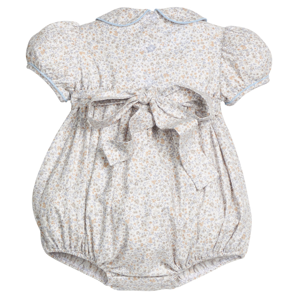 Back view of Smocked Peter Pan Bubble in Winthrop Floral showcasing tied sash bow, puff sleeves, and Peter Pan collar on white background