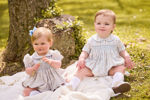 little english classic children's clothing baby light blue, cream, and light tan floral bubble for girl and plaid for boy with peter pan collar, chest smocking, and embroidery, for fall 