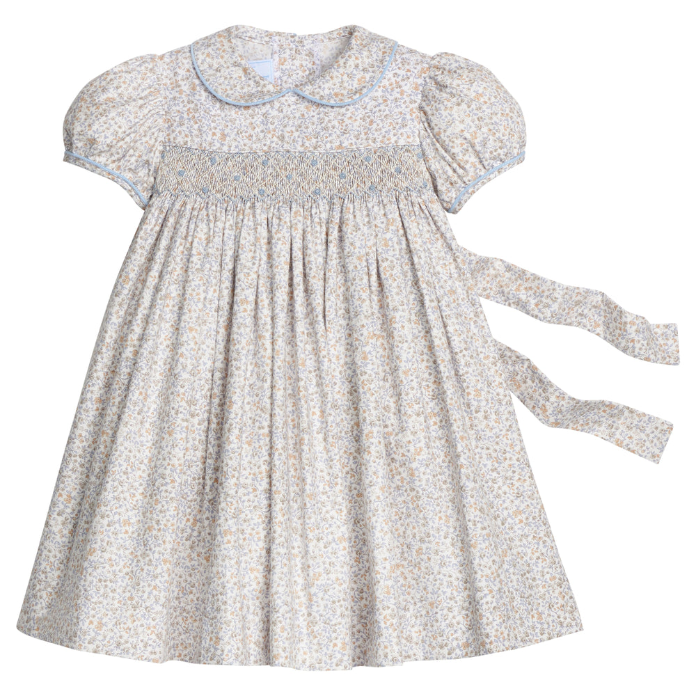 Front view of Smocked Peter Pan dress in Winthrop Floral showing smocked chest, Peter Pan collar, cap sleeves, and back tie sash