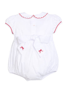 Little English traditional children's clothing.  Puff sleeve white peter pan bubble with scalloped collar, red trim, and bow smocking across the chest.  Dressy outfit for baby girls for the holiday