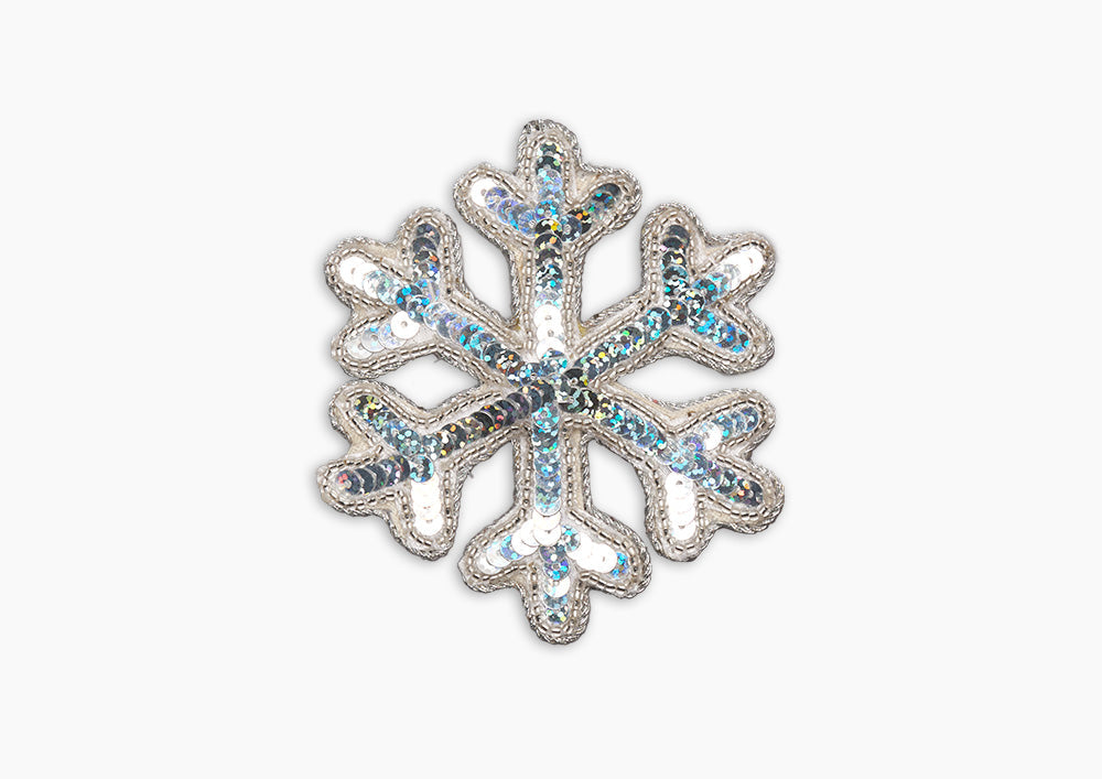 Front view of Snowflake Silver Ornament showcasing bead and metallic thread embellishment on velveteen fabric with white background
