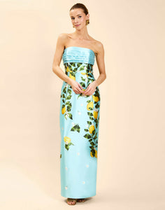 Solstice Gown in Sorrento Citrus poly silk twill with strapless neckline, removable bow, convertible bodice, and side pockets.