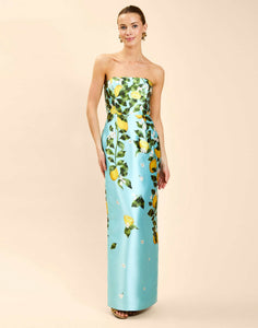 Solstice Gown in Sorrento Citrus poly silk twill with strapless neckline, removable bow, convertible bodice, and side pockets.