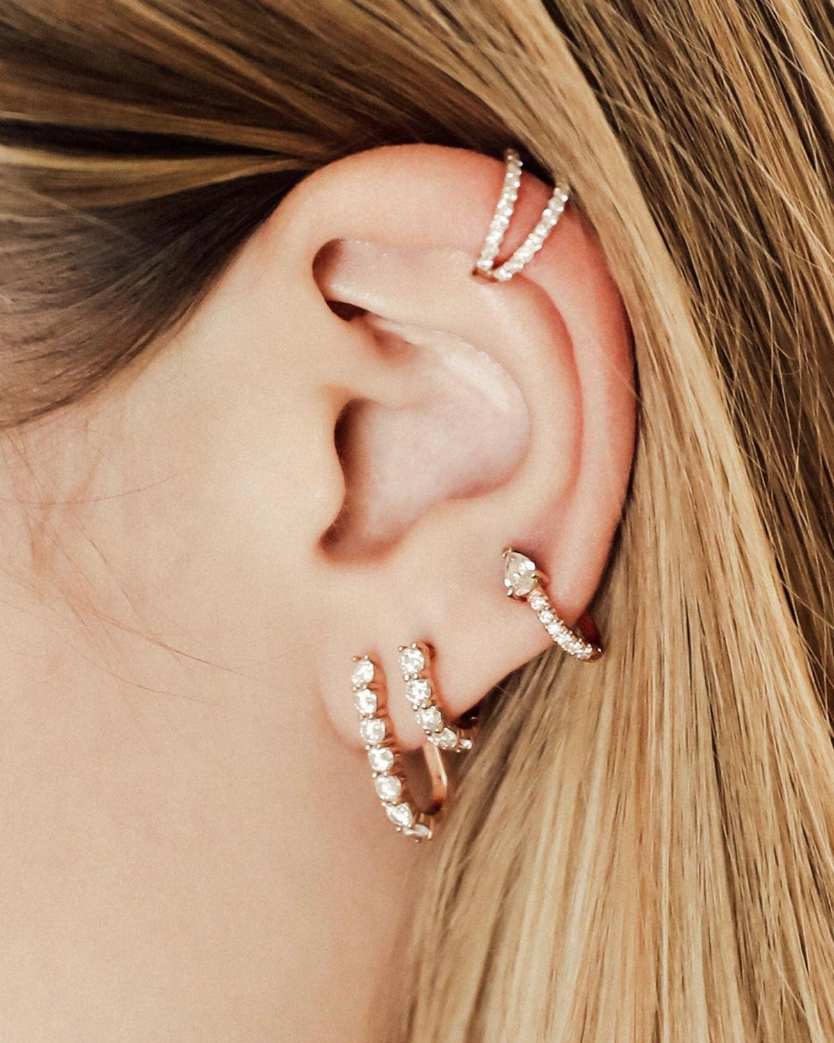 Sparkler Pin Earrings shown stacked with a Sparkler Huggie and Serpent Huggie, 14k yellow gold, 14k rose gold, 14k white gold