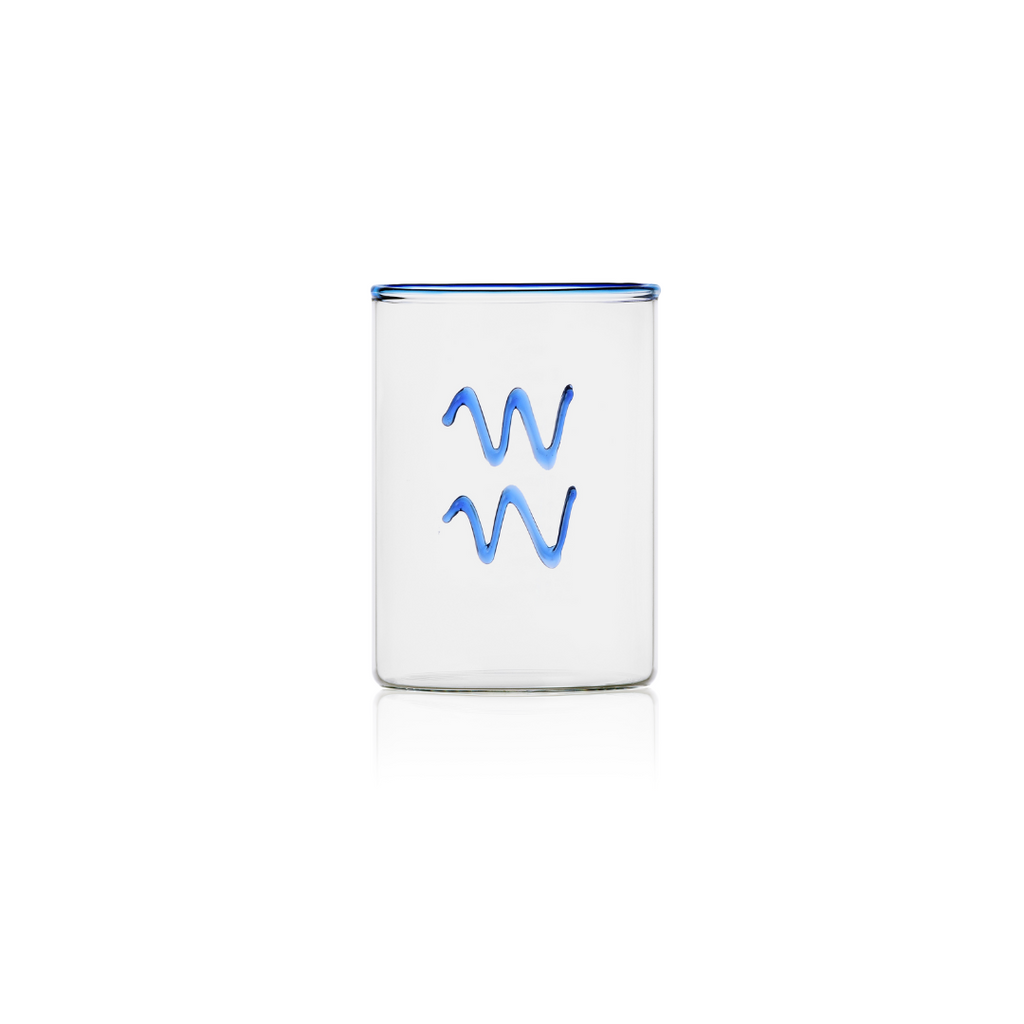 ThisÊhandblownÊclearÊglass tumbler withÊroyal blueÊrim and aquarius sign on the outside in cobalt blue glass brings just the right amount of colour to the table.ÊThe perfect gift under $50