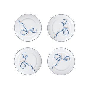Set of Four Ribbon Desset Plates in Blue. WeÕre willing to bet your favorite foodie has never seen dinner plates quite like these. Designed by artist and designer Adam Charlap Hyman for SprezzÕs holiday collection, these plates feature a 3D-like ribbon design inspired by 17th- and 18th-century paintings. These fun plates are available in two sizes and three colors.