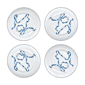 A set of four ribbon dinner plates in Blue. Comprised of a series of ribbon adorned plates, the collection is a delightful departure from traditional holiday decor. The plates are inspired by prints of citrus fruits from the 17th and early 18th centuries showing ribbons bearing the names of the depicted fruit.
