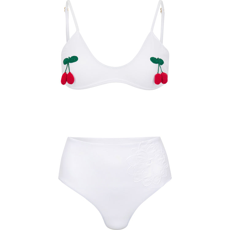 Front view of Stella bikini set in white showcasing crocheted cherry appliques and high-waisted bottom on white background